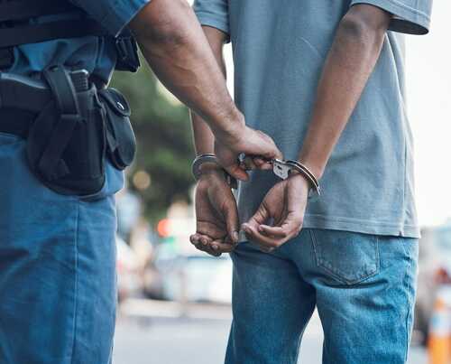 Handcuffs,,Police,And,Hands,Of,Police,Man,With,Criminal,In