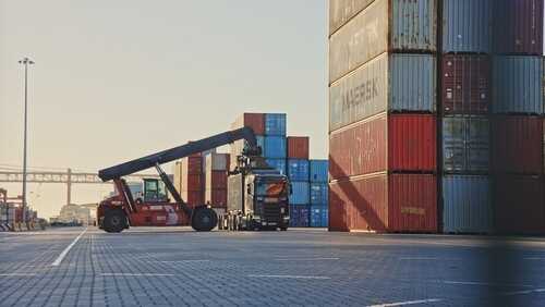 Truck,Unload,Many,Big,Red,Intermodal,Containers,Time,Lapse.,Busy