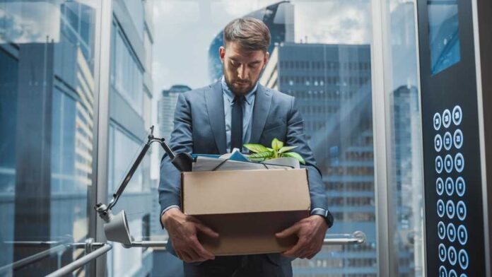 Fired,Manager,Going,Down,From,Office,In,A,Glass,Elevator