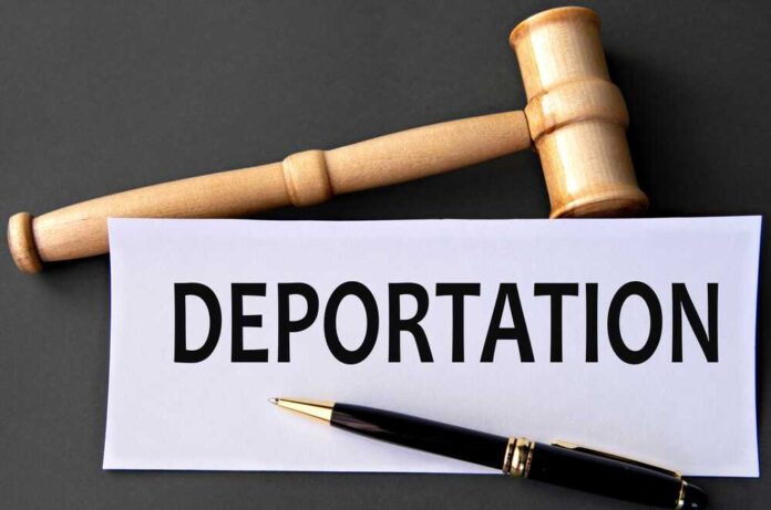 Deportation,-,Word,On,White,Paper,On,Dark,Background,With