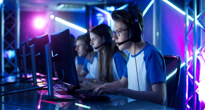 Team,Of,Teenage,Gamers,Play,In,Multiplayer,Pc,Video,Game