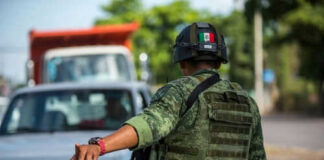 Soldier directing traffic on a busy road