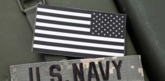 US Navy patch and black and white flag