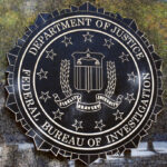 FBI seal on a concrete wall outdoors