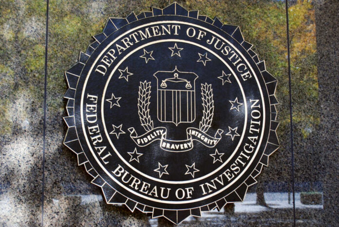 FBI seal on a concrete wall outdoors