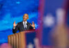 Obama’s Libya Bombing: Why No Outrage? Man speaking at podium with blue starry background