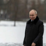 PUTIN THREATENS Europe Gas Shutoff Person in dark coat standing on snowcovered ground
