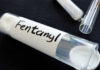 Unexpected Drop: Fentanyl’s Potency Crumbles A glass container labeled 'Fentanyl' with a white powder inside
