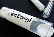Unexpected Drop: Fentanyl’s Potency Crumbles A glass container labeled 'Fentanyl' with a white powder inside