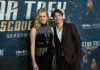 Kamala Criticism Sparks O’Connell Family Clash Two celebrities posing on the red carpet at a Star Trek Discovery event