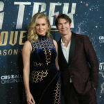 Two celebrities posing on the red carpet at a Star Trek Discovery event