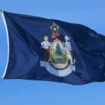 Flag of Maine featuring the state seal and blue background