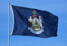 Flag of Maine featuring the state seal and blue background