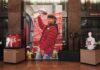 Display of Kansas City Chiefs memorabilia with a large poster of a player holding a trophy