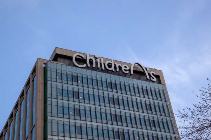 Exterior view of a children's hospital building with a clear sky