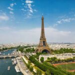 Aerial view of the Eiffel Tower in Paris with the Seine River and cityscape