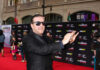 Healthcare Tribunal Slams “Comedy” Excuse A man in sunglasses poses on the red carpet at a celebrity event