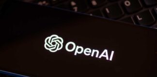 Close-up of a smartphone displaying the OpenAI logo on a dark screen