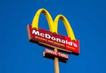 McDonald’s Pricing Model Sparks Outrage McDonald's restaurant sign with drive-thru indication