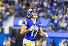 Football player in a blue and yellow uniform celebrating during a game