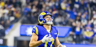 Football player in a blue and yellow uniform celebrating during a game