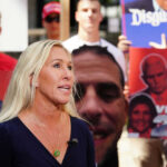 I dont know who they are. A woman speaks in crowd.