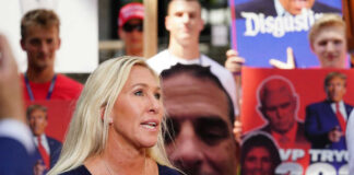 I dont know who they are. A woman speaks in crowd.