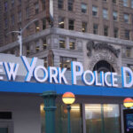 Signage of the New York Police Department in an urban setting