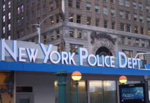 Racial Equity Offices Get Millions Amid NYPD Slash Signage of the New York Police Department in an urban setting