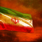 Hezbollah Strategy Exposed: Iran’s Proxy Power Play Iranian flag waving against a dramatic orange sky
