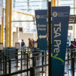 Signage indicating TSA PreCheck entrance at an airport