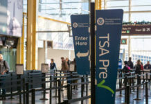 Signage indicating TSA PreCheck entrance at an airport