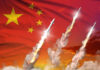 Missiles launching against a backdrop of the Chinese flag