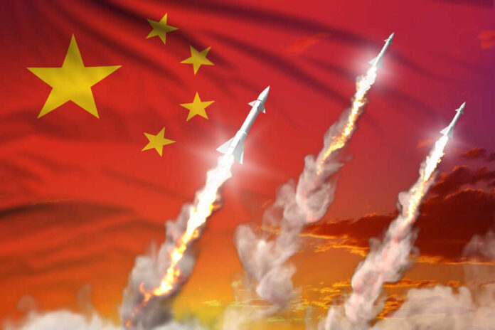 Missiles launching against a backdrop of the Chinese flag