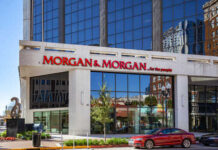 Exterior view of a modern law office building with large windows and signage