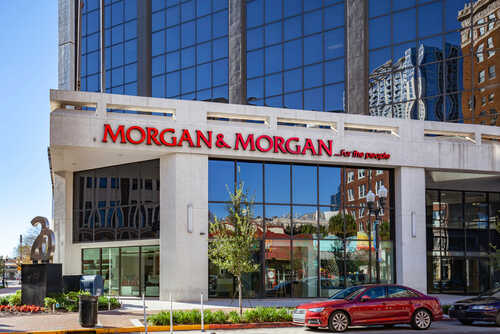Exterior view of a modern law office building with large windows and signage