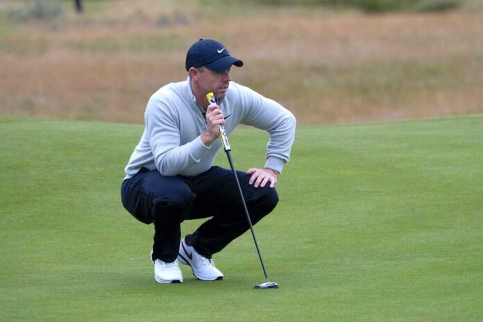 Golfer crouching on the green, preparing to putt