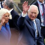 Royal couple waving during a public event