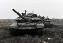 U.S. Weapons Unveil Shocking Russian Vulnerabilities Two military tanks positioned in a muddy field