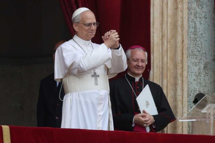 Pope giving a blessing from a balcony