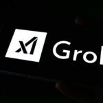 Grok AI’s SHOCKING Deepfake Production Exposed A smartphone screen displaying the Grok logo in white against a dark background