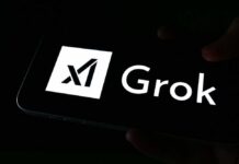 A smartphone screen displaying the Grok logo in white against a dark background