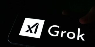 A smartphone screen displaying the Grok logo in white against a dark background
