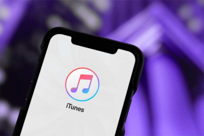 shutterstock_2681466793.jpg Close-up of a smartphone displaying the iTunes app logo