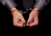 Hands in handcuffs, symbolizing arrest or detention