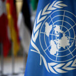 Iran’s UN Role Exposes Glaring Hypocrisy United Nations flag with other flags in background
