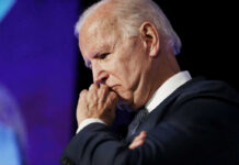 Biden’s America in Decline? Trump Says Yes! elderly man in suit resting chin on hand in thought