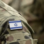 Close-up of a soldier's uniform with an Israeli flag patch