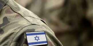 Close-up of a soldier's uniform with an Israeli flag patch