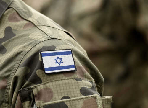 Close-up of a soldier's uniform with an Israeli flag patch